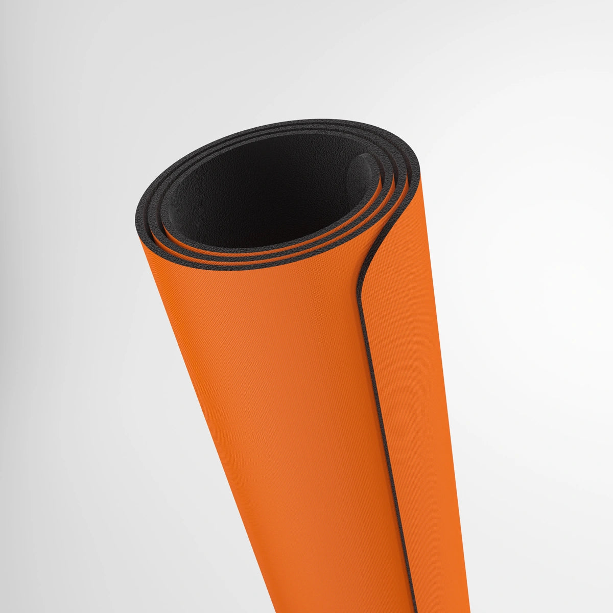GameGenic: Playmat: Prime: Orange, a rolled-up exercise mat ideal for card games, featuring a cushioned surface, anti-slip back, and subtle logo.