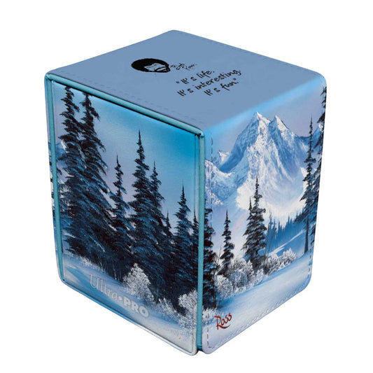 Ultra PRO Alcove Flip: Bob Ross: Winter Paradise deck box with snowy mountain art, holds 100+ cards, secure magnetic closure, dual thumb notches for easy access.