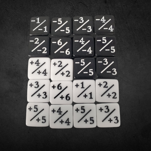 Counter and Stat Tracking Dice Set: 20 black and white plastic tiles with positive and negative values for tracking power and toughness in tabletop games.