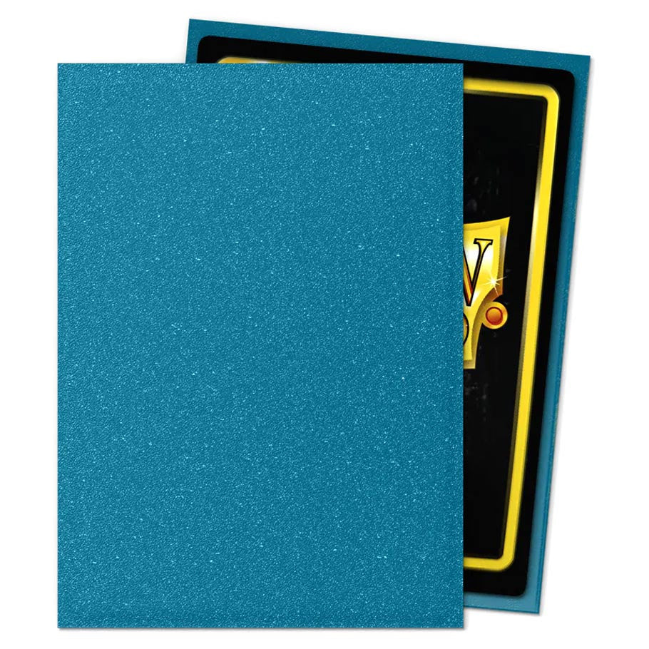 Dragon Shield Amazonite - Matte Sleeves, sparkly teal card protectors displayed with a standard trading card, ideal for game enthusiasts seeking durable, stylish deck accessories.