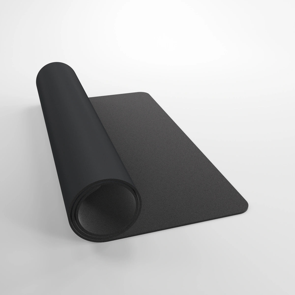 GameGenic: Playmat: Prime: Black, a 61x35 cm cushioned mat with anti-slip backing, partially rolled, ideal for card games and dice rolling.