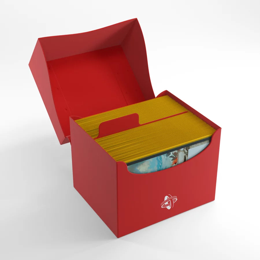 Gamegenic SIDE HOLDER 100+ XL Red Deck Box, displaying cards with yellow edges, hinged lid, central divider, and white logo, ideal for organizing 100 double-sleeved cards.