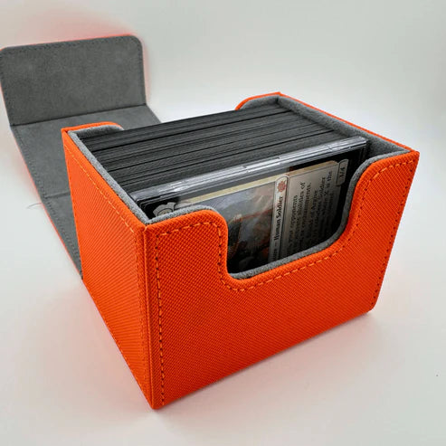 Nerd Gear Commander Shield - 5 Pack displayed in an orange fabric deck box, showcasing sleeved Magic: The Gathering cards neatly organized for optimal protection.